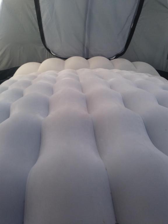 a close up of a white mattress on a bed at AREA MULTISPORT Camping & Camper in Canicattini Bagni