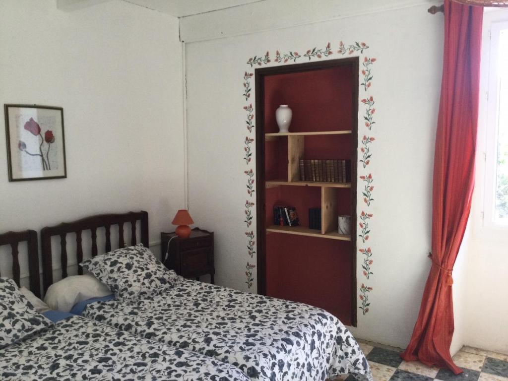Postel nebo postele na pokoji v ubytování Chez Bacchus