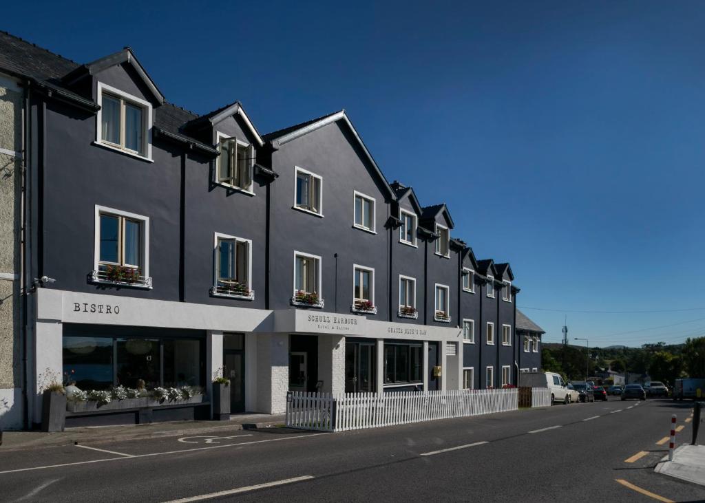 a large building with a large window on the side of it at Schull Harbour Hotel & Leisure Centre in Schull
