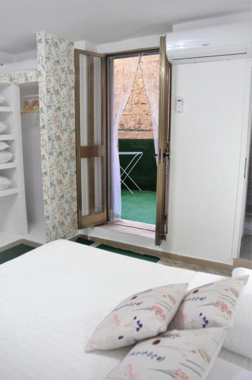 Posteľ alebo postele v izbe v ubytovaní Enry's House