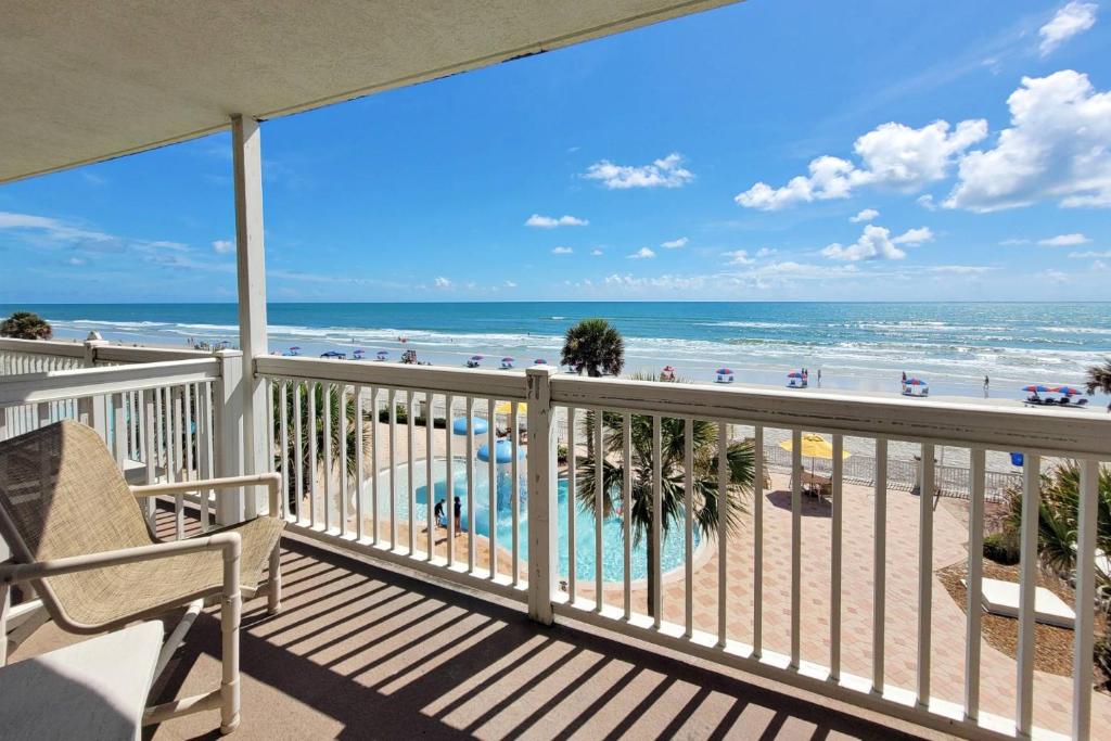 a balcony with a view of the beach and the ocean at Daytona Beach Resort Unit #302 in Daytona Beach