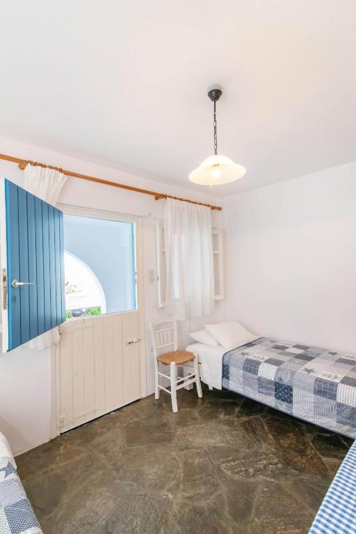 Postel nebo postele na pokoji v ubytování Porto Kalma