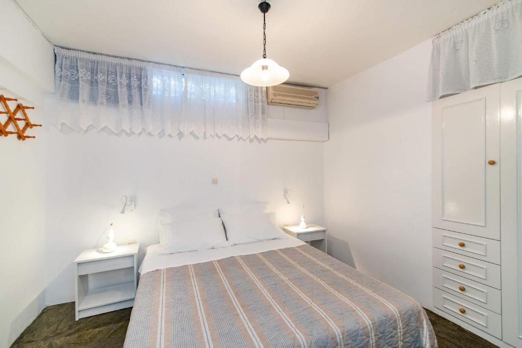 Postel nebo postele na pokoji v ubytování Porto Kalma