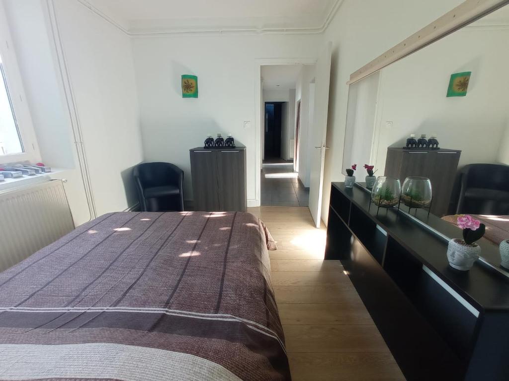 Postel nebo postele na pokoji v ubytování LE VIEUX MOULIN