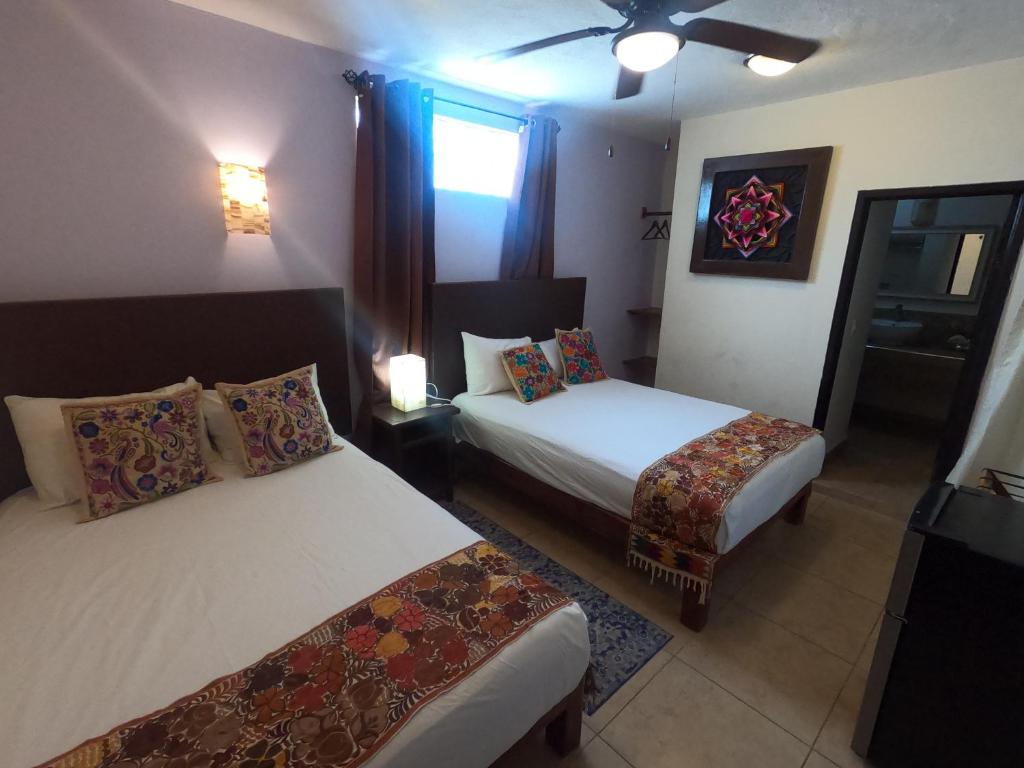 Postel nebo postele na pokoji v ubytování Hotel Balché