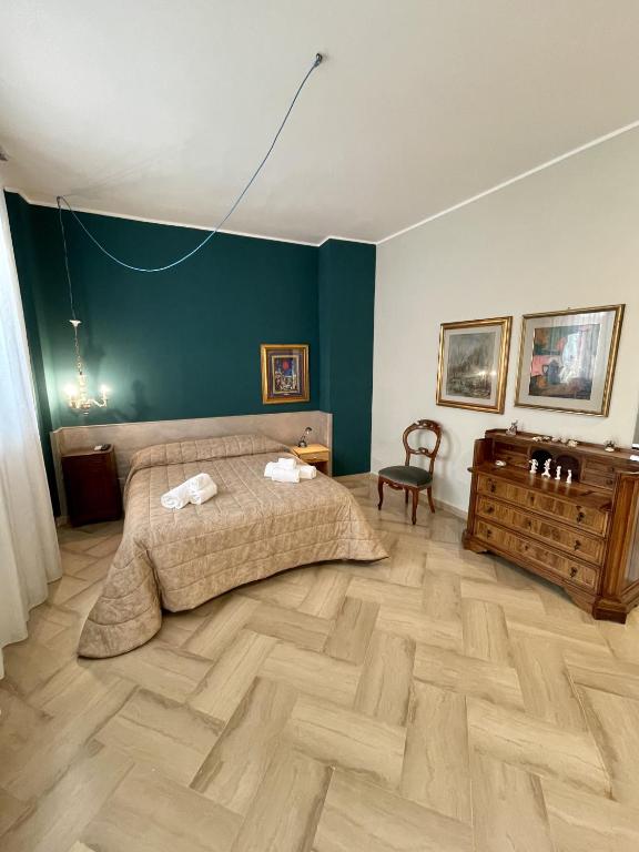 Posteľ alebo postele v izbe v ubytovaní 4 Balconi House-Elegante dimora nel centro storico