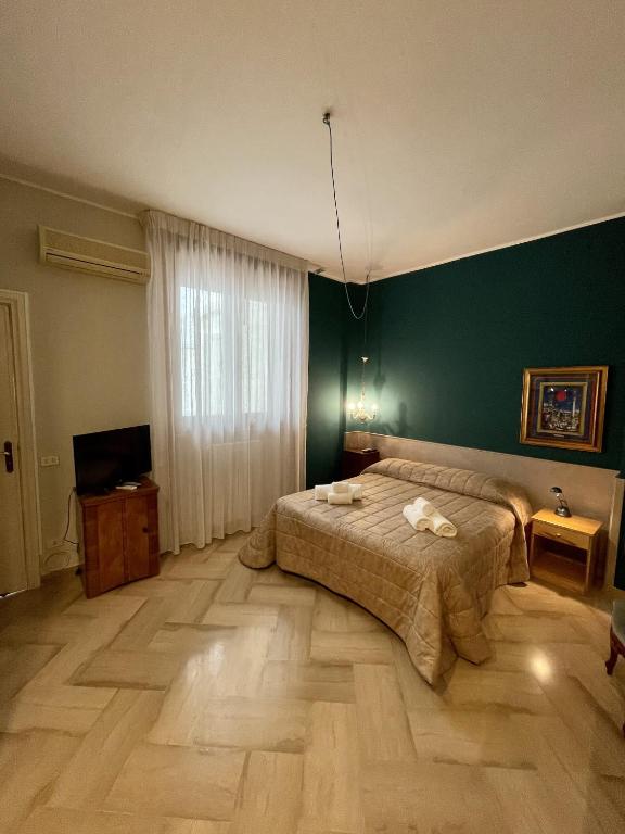 Posteľ alebo postele v izbe v ubytovaní 4 Balconi House-Elegante dimora nel centro storico