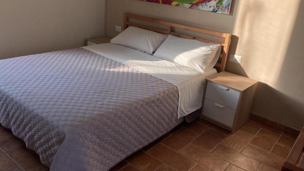 Postel nebo postele na pokoji v ubytování Borgo Bruno