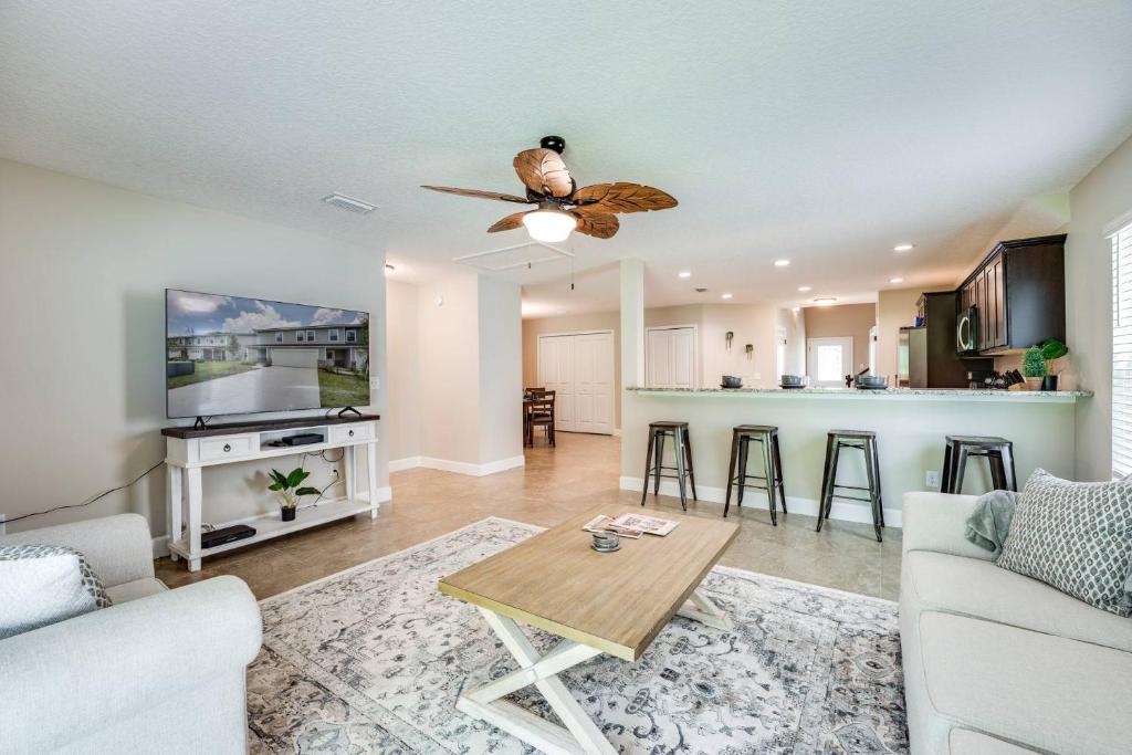a living room with a couch and a ceiling fan at Jennings Townhome in Orange Park