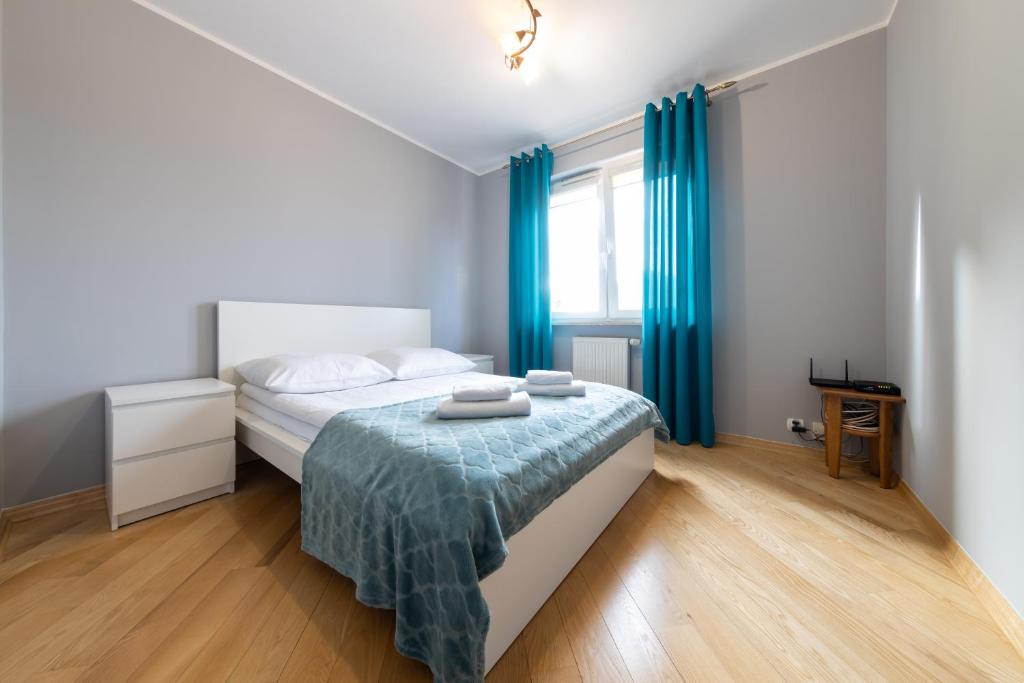 Posteľ alebo postele v izbe v ubytovaní Apartament z 3 sypialniami