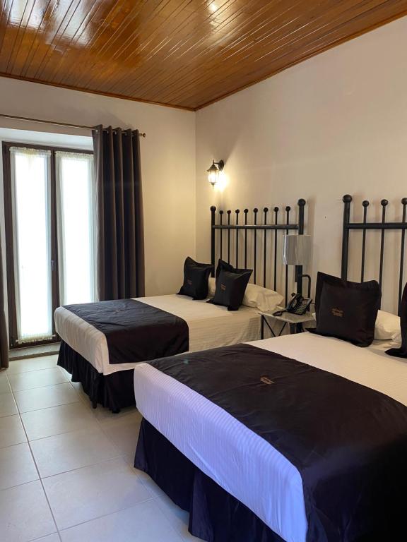 Postel nebo postele na pokoji v ubytování Hotel Plata Condesa