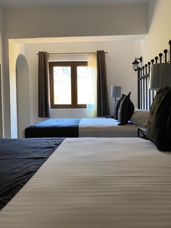 Postel nebo postele na pokoji v ubytování Hotel Plata Condesa