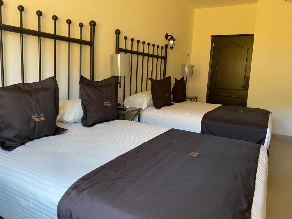 Postel nebo postele na pokoji v ubytování Hotel Plata Condesa