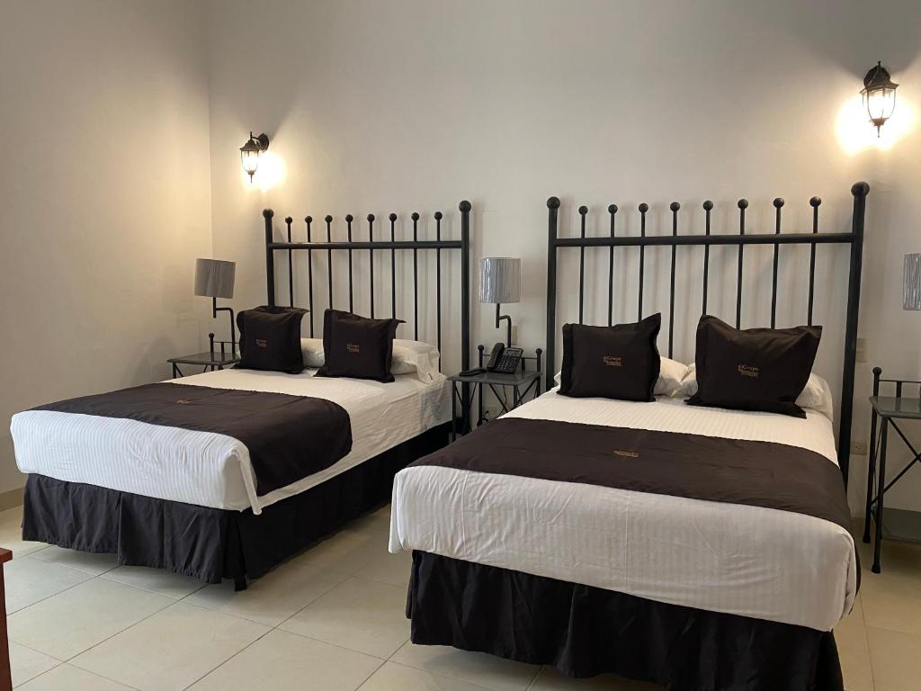 Postel nebo postele na pokoji v ubytování Hotel Plata Condesa