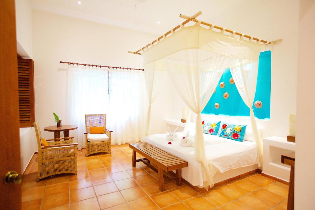 Postel nebo postele na pokoji v ubytování Hotel Rancho Encantado