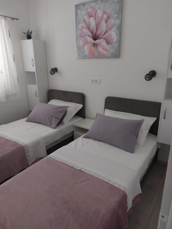 Postel nebo postele na pokoji v ubytování HOLIDAY HOME KATE