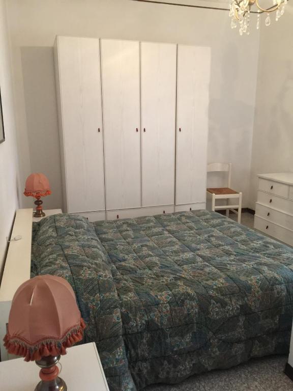Postel nebo postele na pokoji v ubytování Giò Appartamenti Vacanze