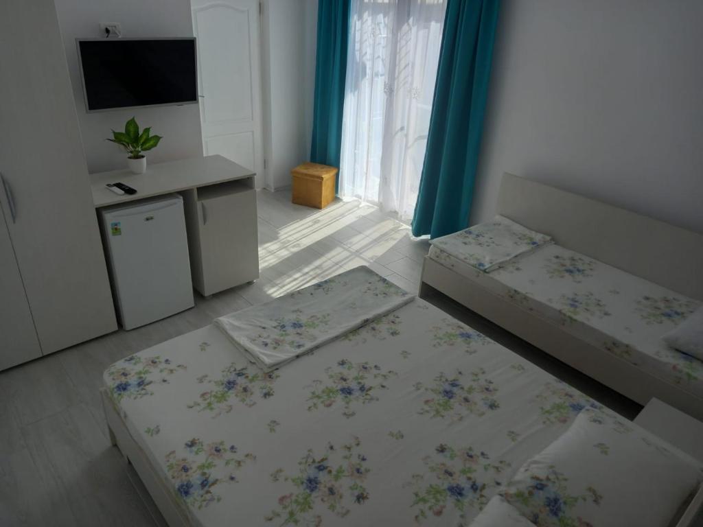 Postel nebo postele na pokoji v ubytování Casa AnaMaria