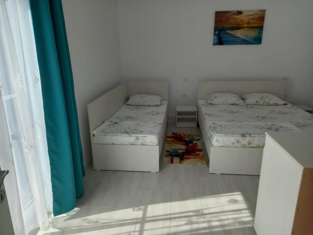 Postel nebo postele na pokoji v ubytování Casa AnaMaria