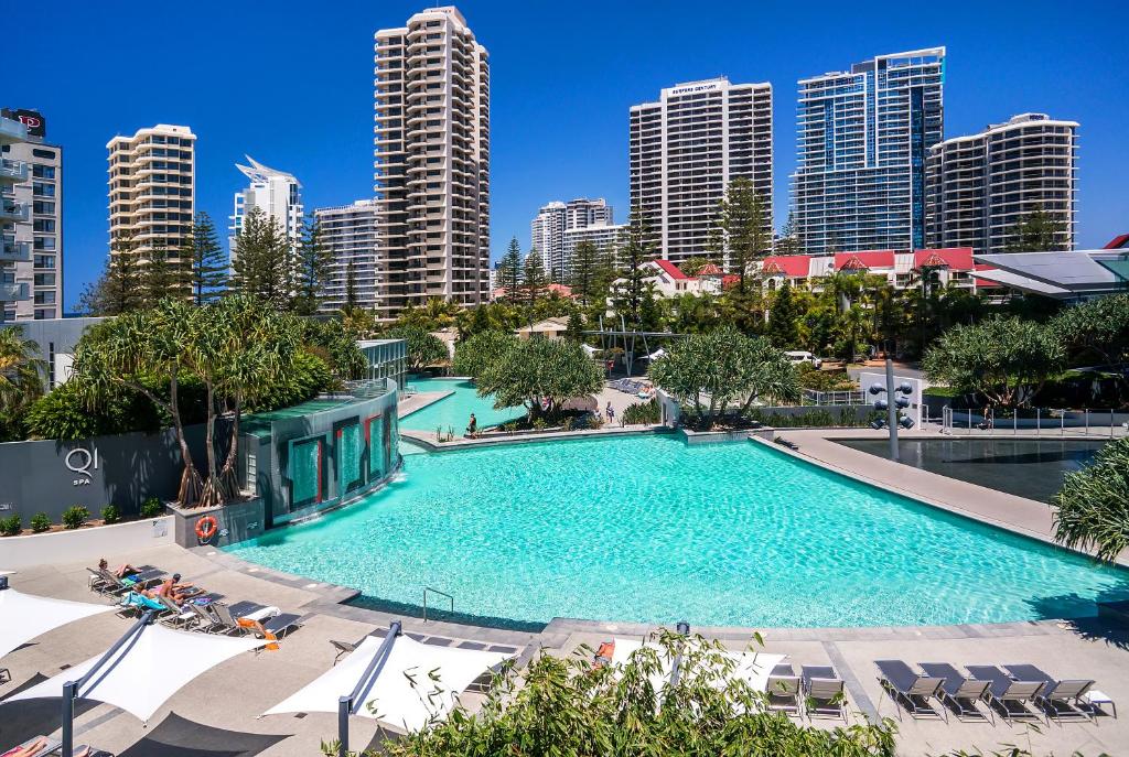 a large swimming pool in a city with tall buildings at Q1 Resort & Spa - Official in Gold Coast
