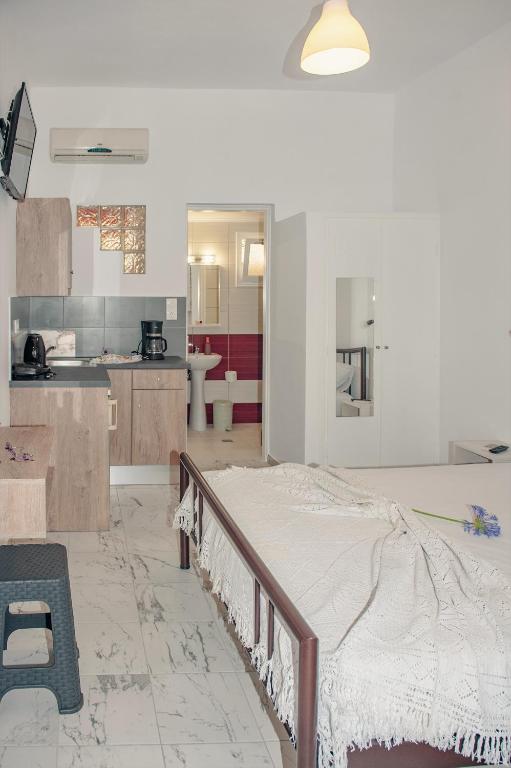 Kuchyň nebo kuchyňský kout v ubytování Petros Giatras - Rooms