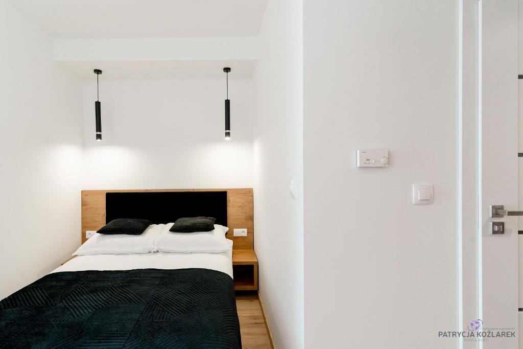 Posteľ alebo postele v izbe v ubytovaní Apartamenty IGMA