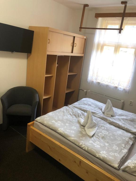 Postel nebo postele na pokoji v ubytování Penzion Štvanice
