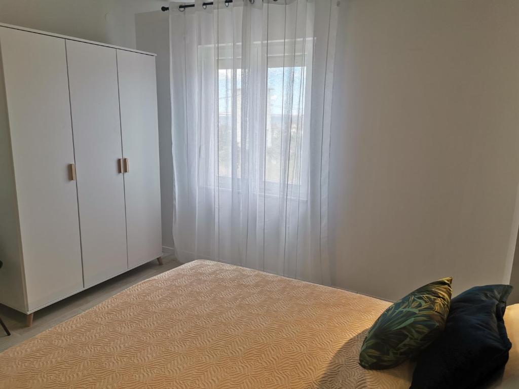 Postel nebo postele na pokoji v ubytování Apartmani Darko