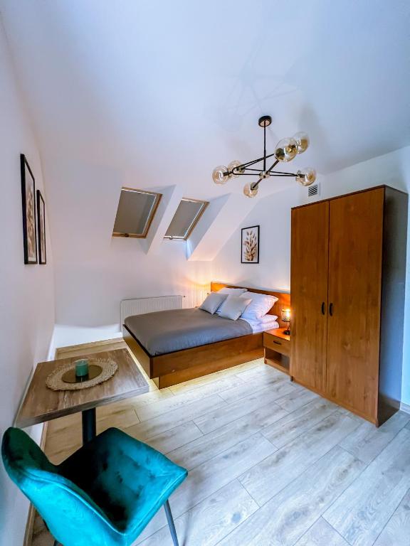 Postel nebo postele na pokoji v ubytování Domek pod Katalpami