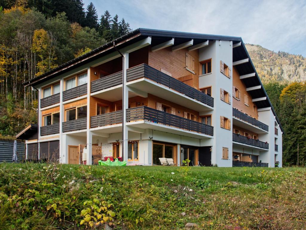 an apartment building with balconies on a hill at Les Cimes du Montblanc in Les Houches
