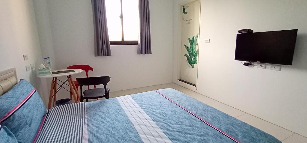 TV a/nebo společenská místnost v ubytování Yu Hai B&B