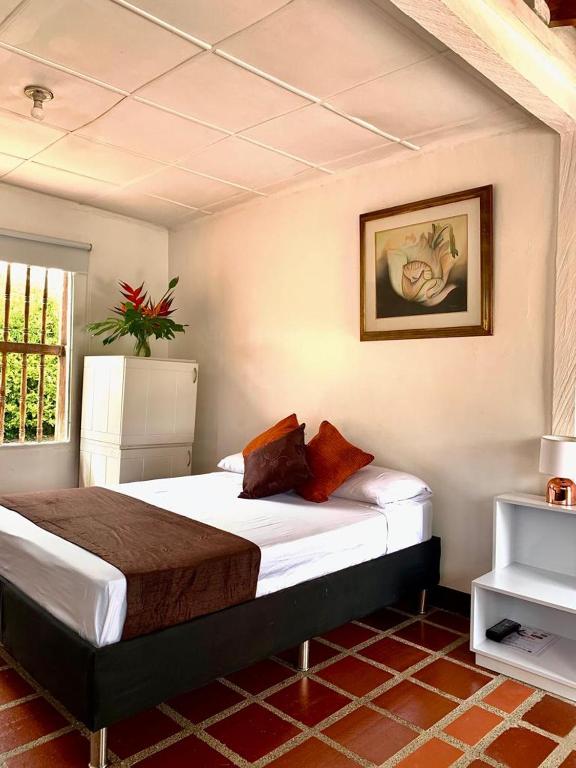 Postel nebo postele na pokoji v ubytování Hotel CSI Llanogrande