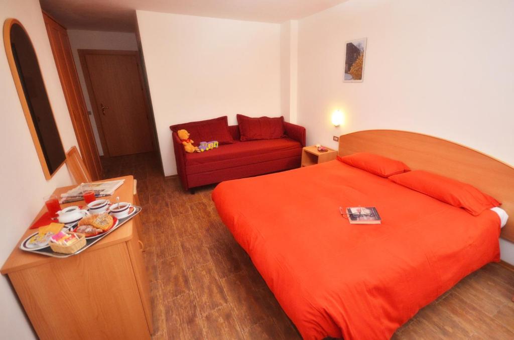 Postel nebo postele na pokoji v ubytování Albergo Sporting