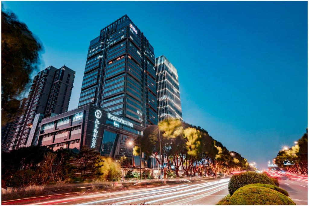 a city with tall buildings and a street with cars at Kunshan Yu Yuan Garden Hotel in Kunshan