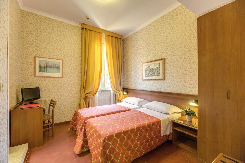 Postel nebo postele na pokoji v ubytování Hotel Corona