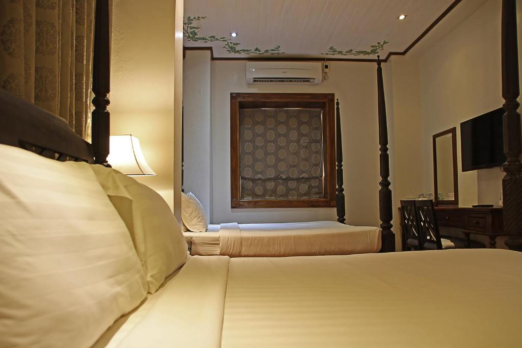 Postel nebo postele na pokoji v ubytování Hotel Veneto De Vigan