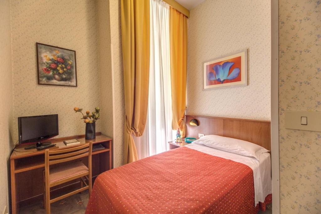 Postel nebo postele na pokoji v ubytování Hotel Corona