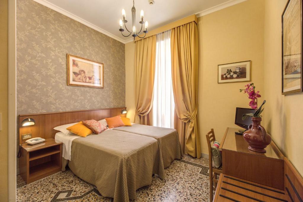Postel nebo postele na pokoji v ubytování Hotel Corona