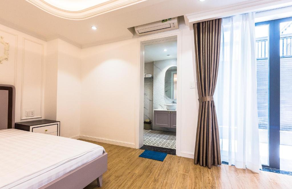 Postel nebo postele na pokoji v ubytování Ngan Ha 2 Apartment