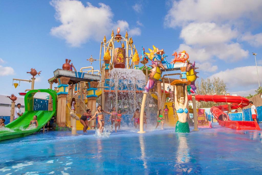 a swimming pool filled with lots of colorful floats at Sol Katmandu Park & Resort in Magaluf