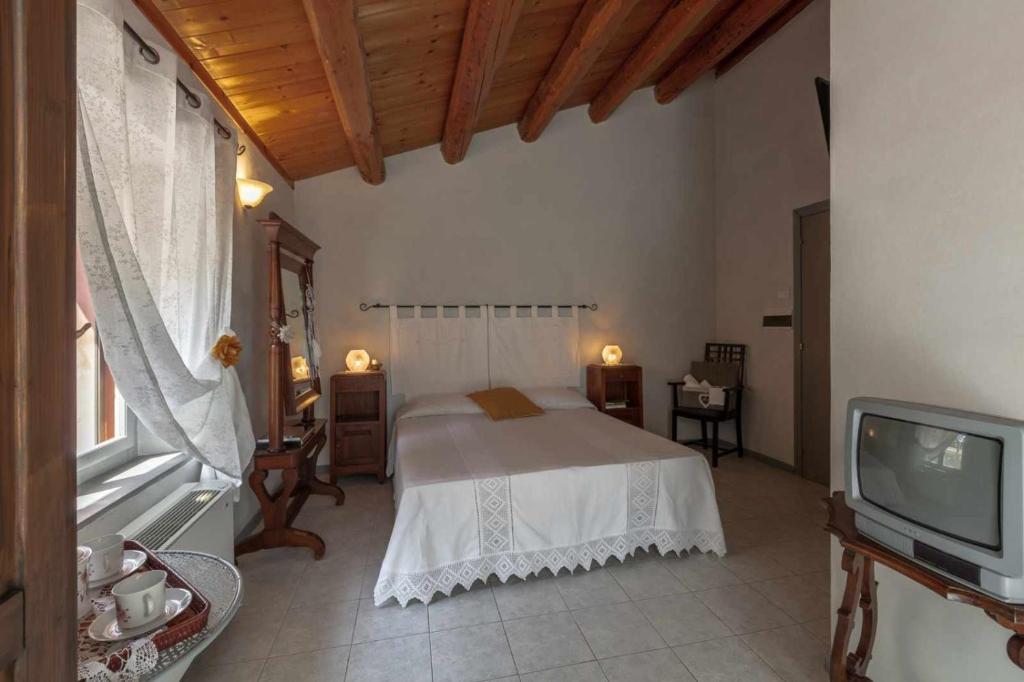 Giường trong phòng chung tại La Meriggia Senigallia
