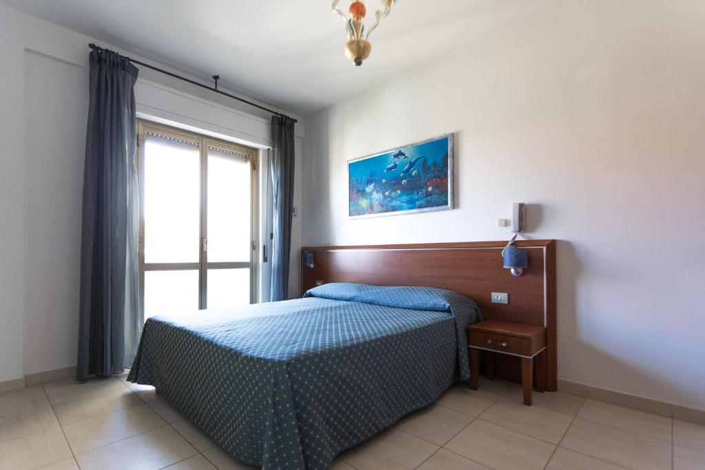 Postel nebo postele na pokoji v ubytování Hotel Abruzzo