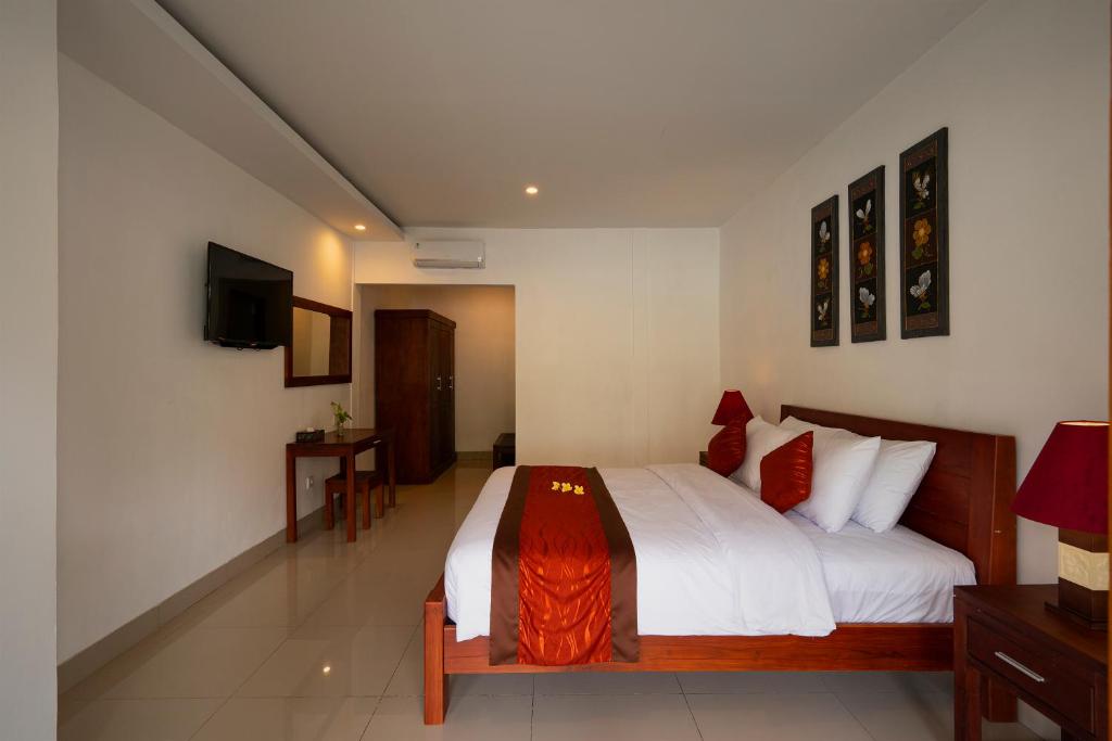 Postel nebo postele na pokoji v ubytování Kusuma Resort Seminyak