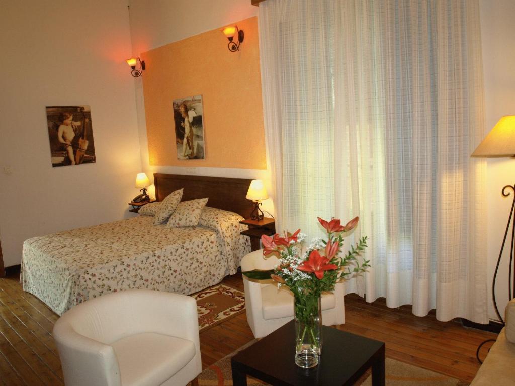 Postel nebo postele na pokoji v ubytování Gran Posada La Mesnada