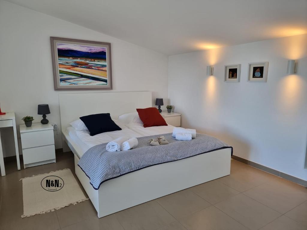 Postel nebo postele na pokoji v ubytování N&N Apartments and Rooms by Locap Group