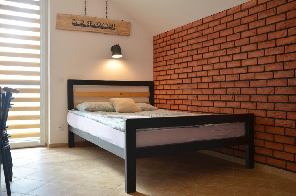 Posteľ alebo postele v izbe v ubytovaní Pensjonat Pod Brzozami