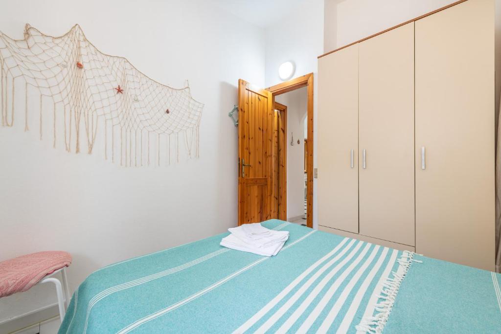 Łóżko lub łóżka w pokoju w obiekcie La Casa di Silvia