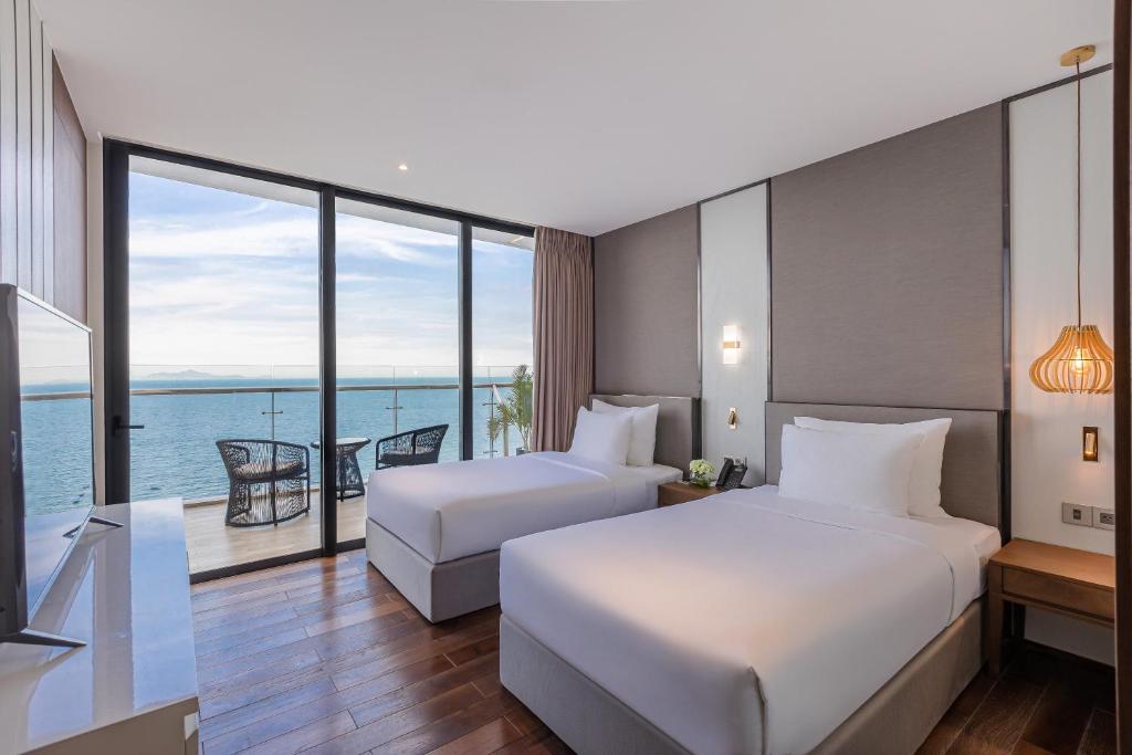 Postel nebo postele na pokoji v ubytování Sel de Mer Hotel & Suites