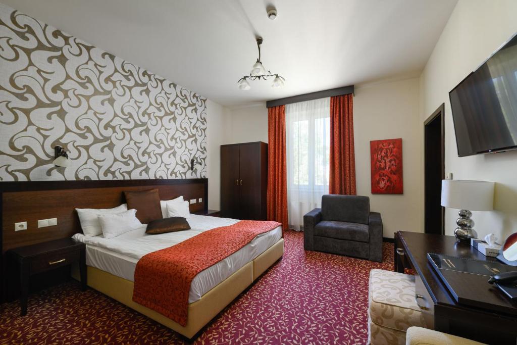 Posteľ alebo postele v izbe v ubytovaní Hotel Aurum