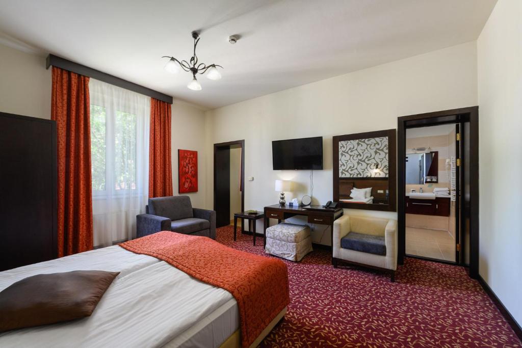 Posteľ alebo postele v izbe v ubytovaní Hotel Aurum